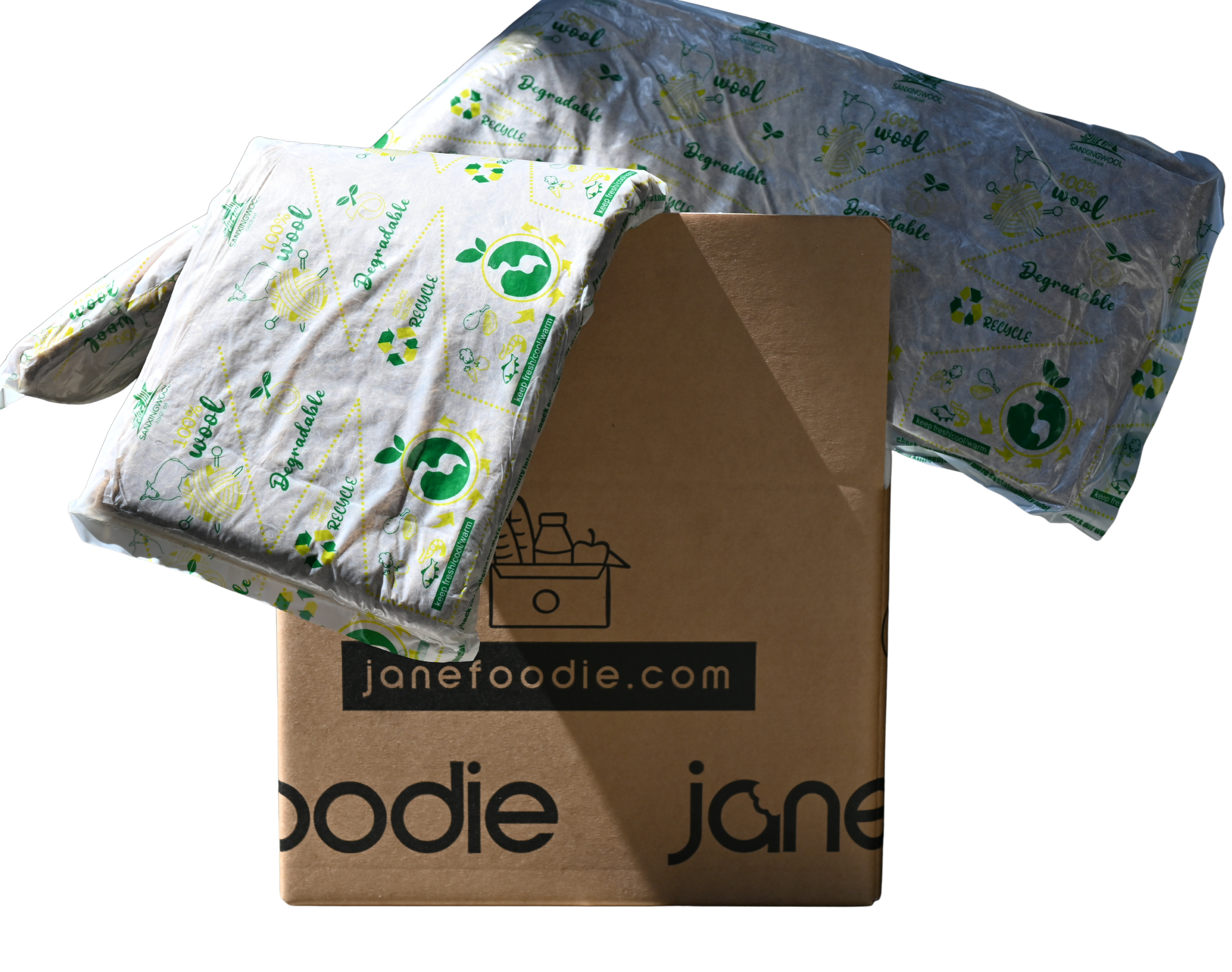 Folded fabric with recycling symbols on a cardboard box labeled 'janefoodie.com'.