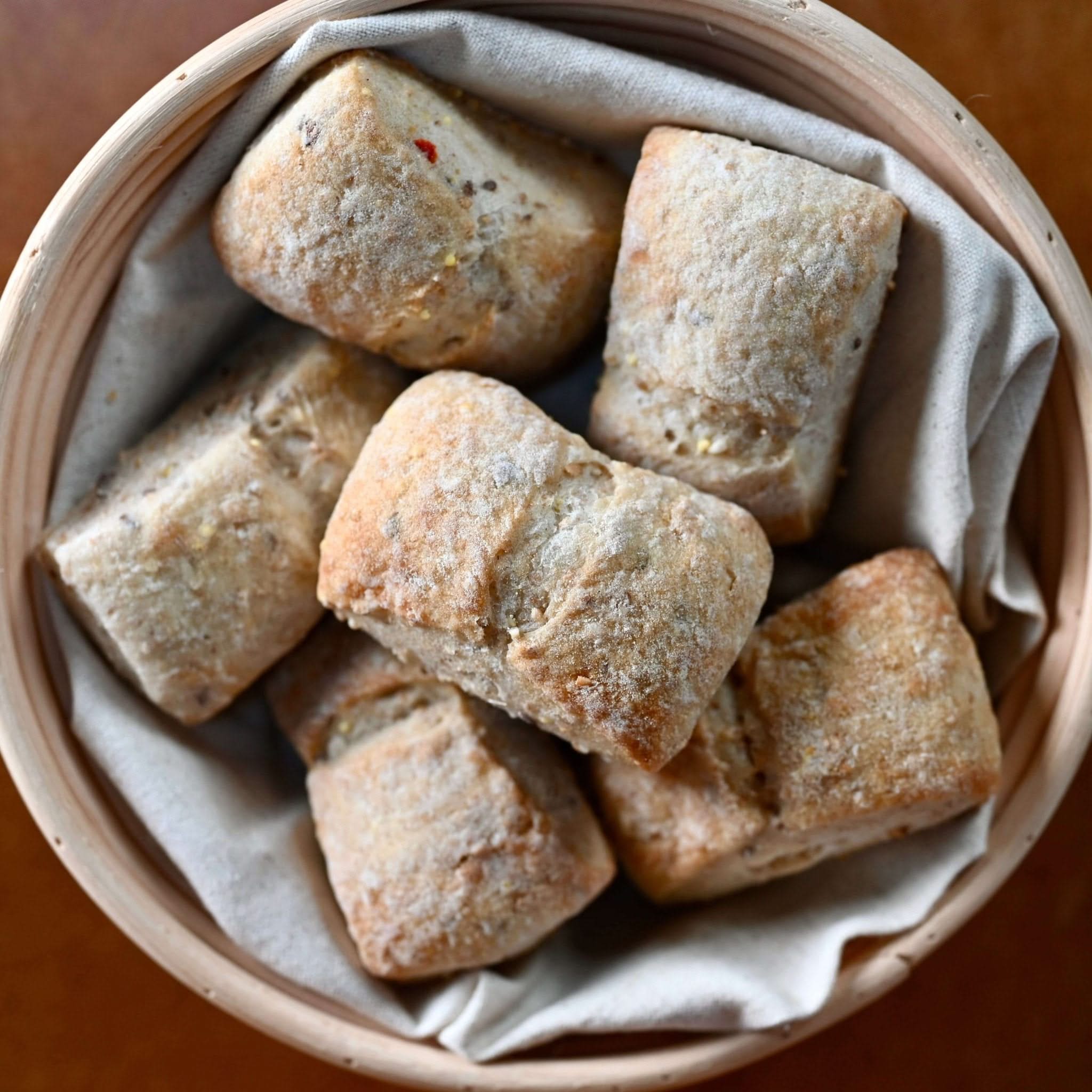 Whole Grain Mini Ciabatta 6-Pack, featuring whole wheat, flax seed, and sesame seeds. No additives, perfect soup partner.