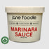 Container of jane foodie marinara sauce on a white background