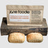 Parbaked/flash frozen sourdough loaves in Jane Foodie packaging, displayed on a rustic wooden block with a neutral gray background